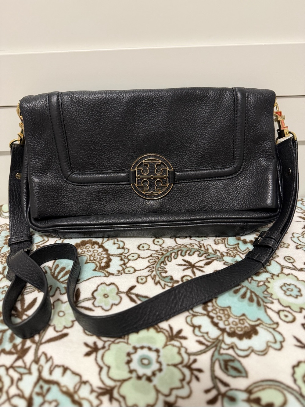 Tory Burch Amanda foldover crossbody bag featuring gold-tone hardware